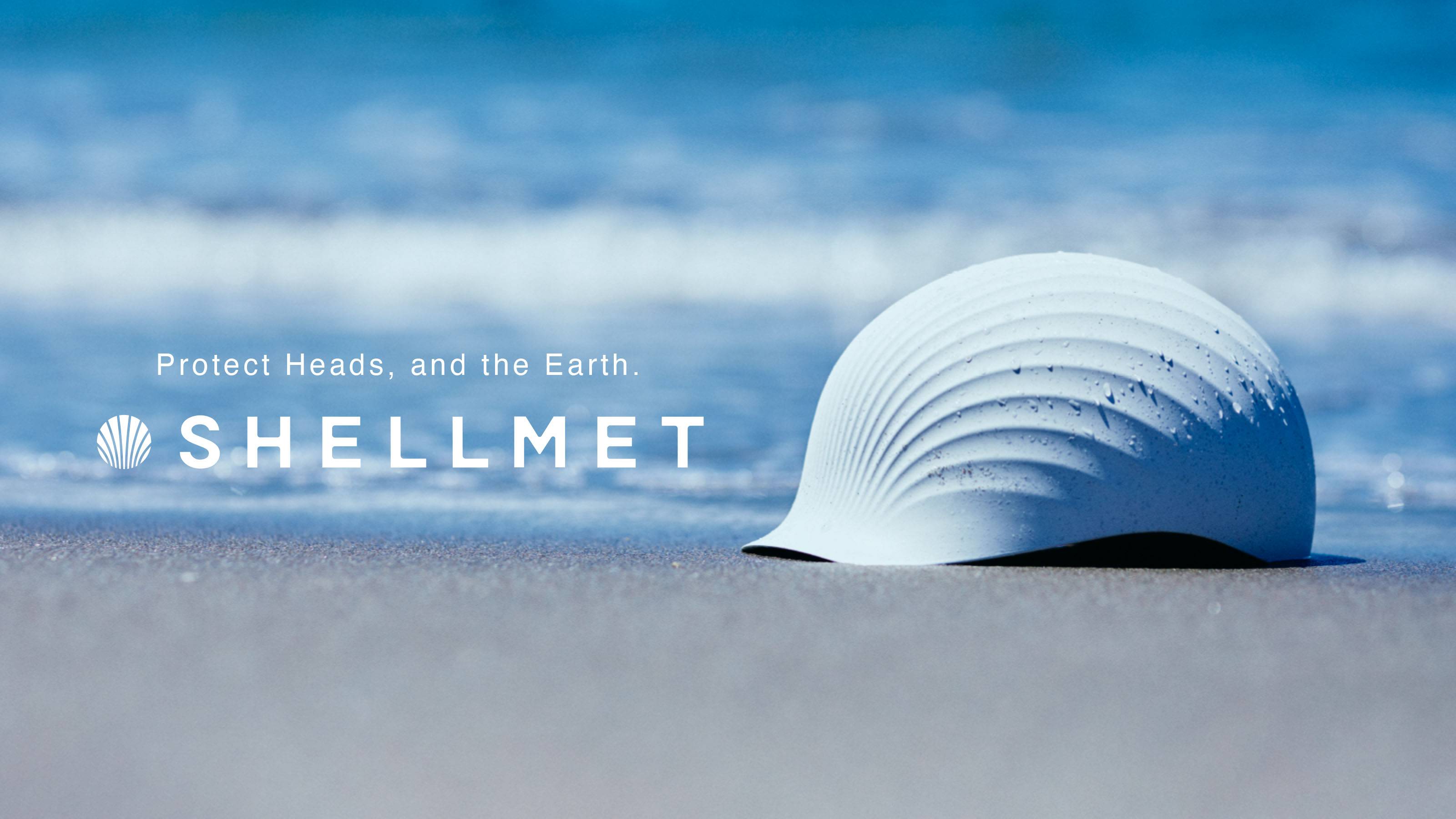 Image of a shell in the form of a helmet on the beach with waves in the background. To the left of the helmet in white copy reads 
