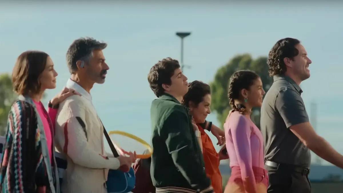 Marcello Hernandez surrounded by people in Nissan ad