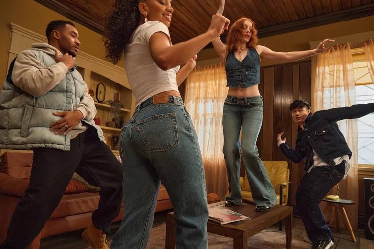 Four people dancing in their Levi's