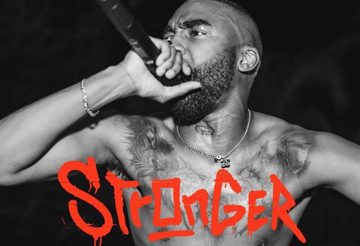 Riky Rick with a microphone over the word "Stronger"