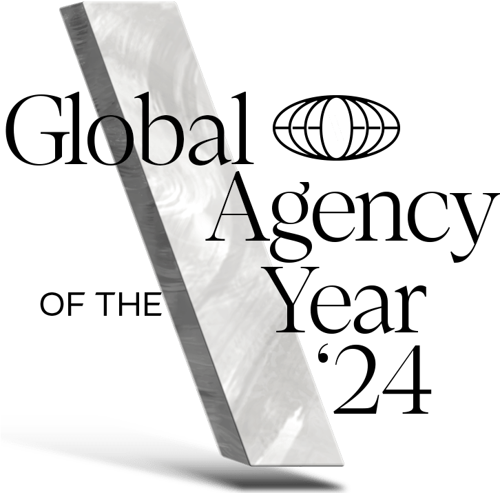 A glass backslash with text that says "Global Agency of the Year"