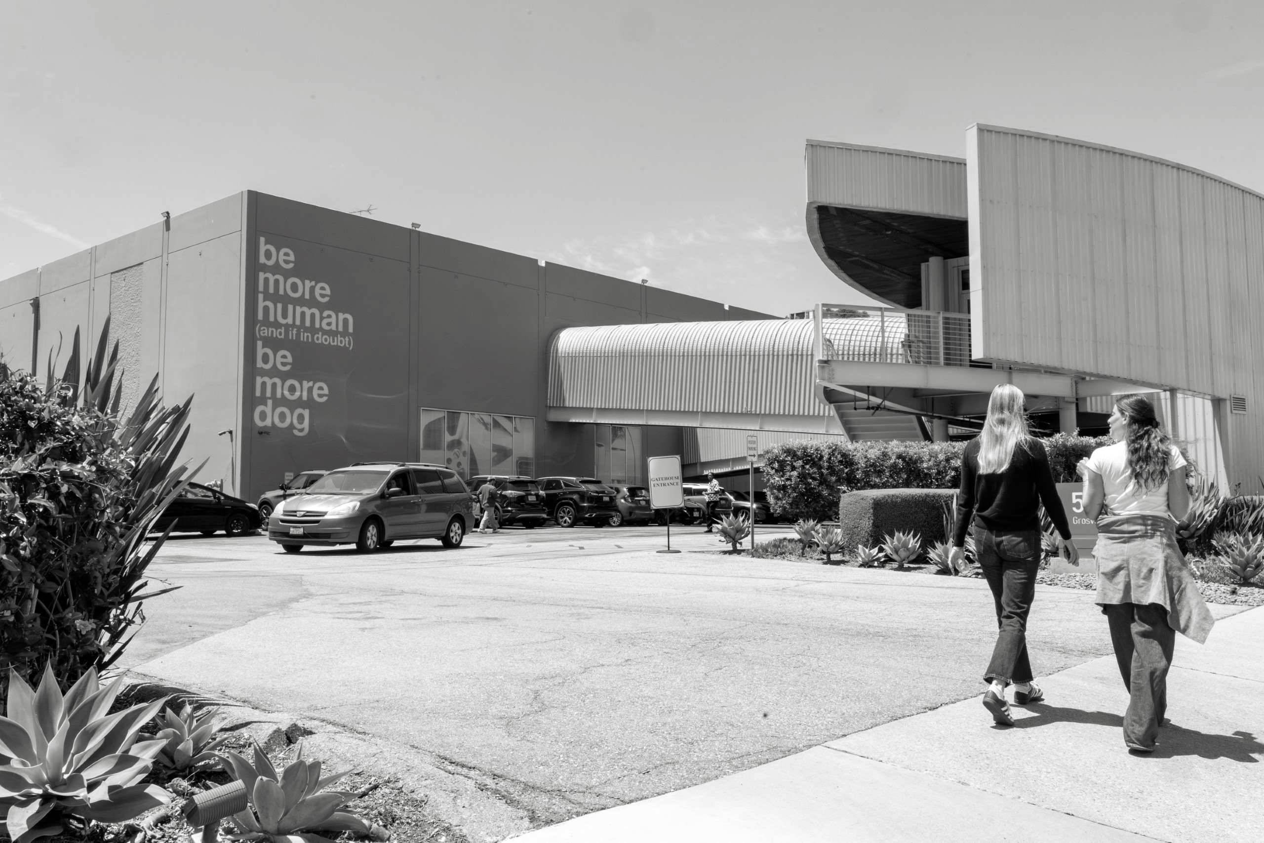 A TBWA mural reads "Be More Human"