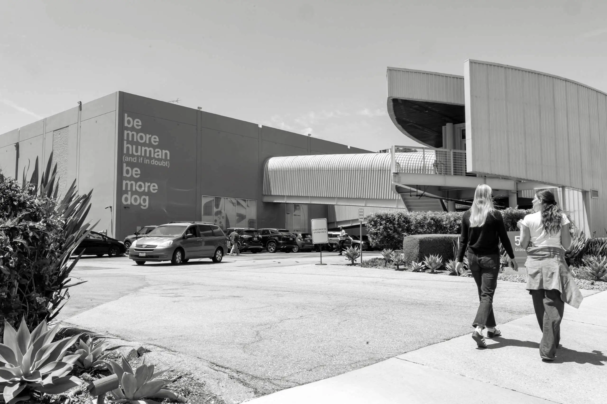 A TBWA mural reads "Be More Human"