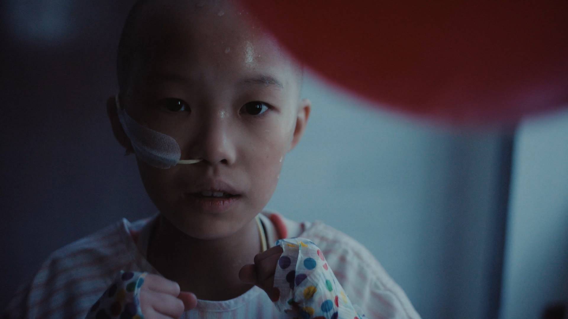 A child in a hospital prepares to fight a birthday balloo. Thumbnail for the award-winning campaign The Count by TBWA Canada.