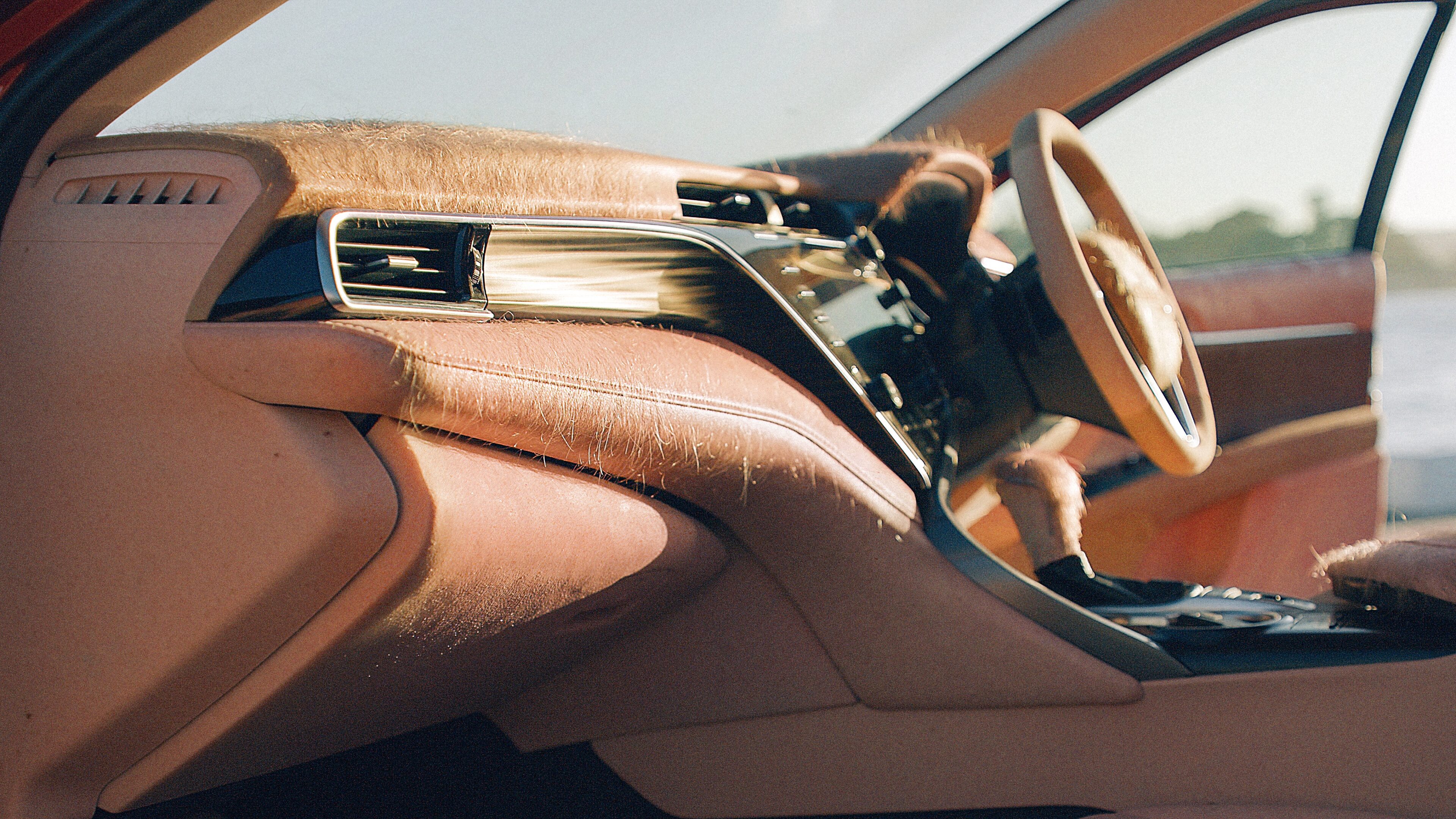 A car is equipped with skin-like upholstery that shows the effects of sun damage, even within your car.